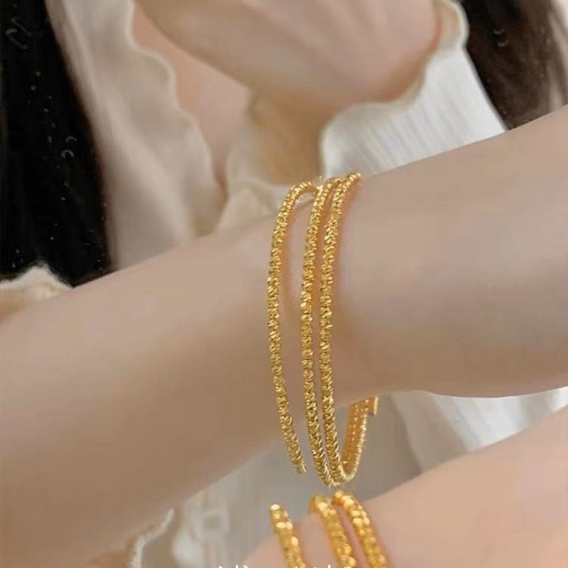 Multi-layered elastic cuff bracelet.