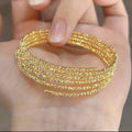 Multi-layered elastic cuff bracelet.