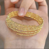 Multi-layered elastic cuff bracelet.