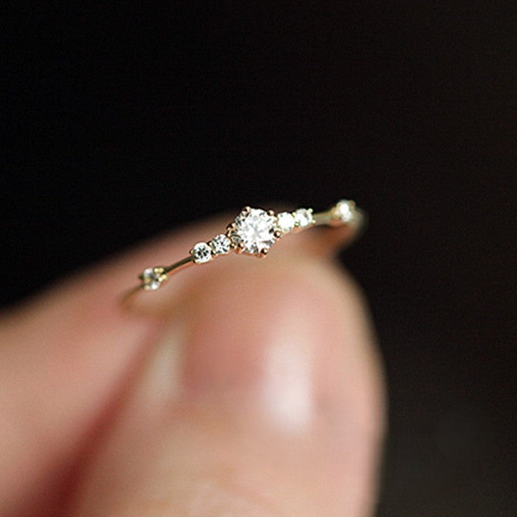 S925 sterling silver plated with 14K gold 7 tiny diamond rings