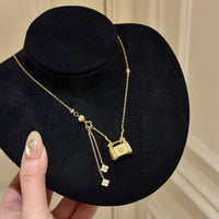 Drawn four-leaf flower lock bag necklace
