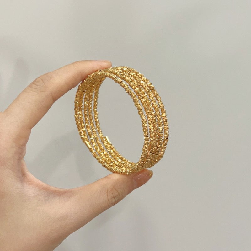 Multi-layered elastic cuff bracelet.