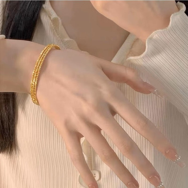 Multi-layered elastic cuff bracelet.