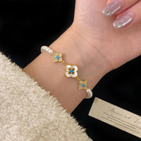 Natural Fritillaria shell with four leaves full of diamonds Swarovski pearl bracelet
