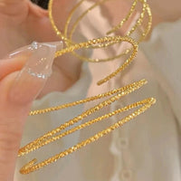 Multi-layered elastic cuff bracelet.